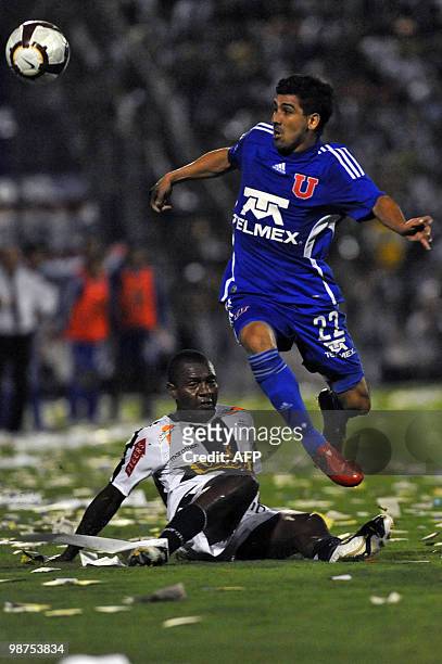 Jose Contreras of Universidad de Chile fights for the ball with Edgar Villamarin of Peruvian Alianza Lima during their Copa Libertadores football...