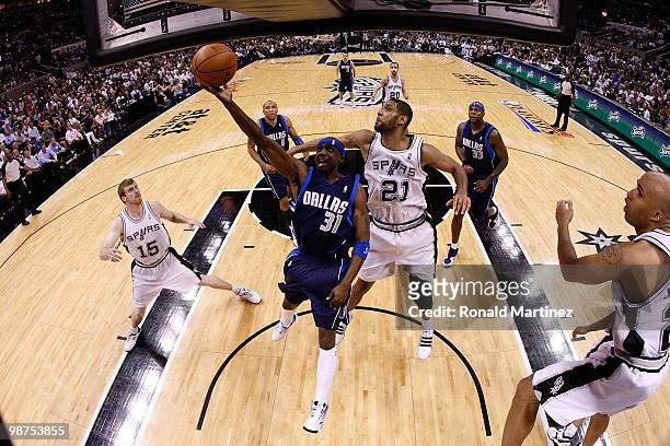 Guard Jason Terry of the Dallas Mavericks takes a shot against Tim Duncan of the San Antonio Spurs in Game Six of the Western Conference...