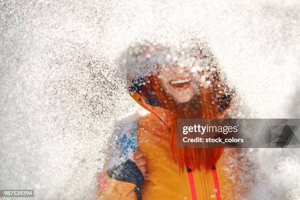 frozen smile - orange jacket stock pictures, royalty-free photos & images
