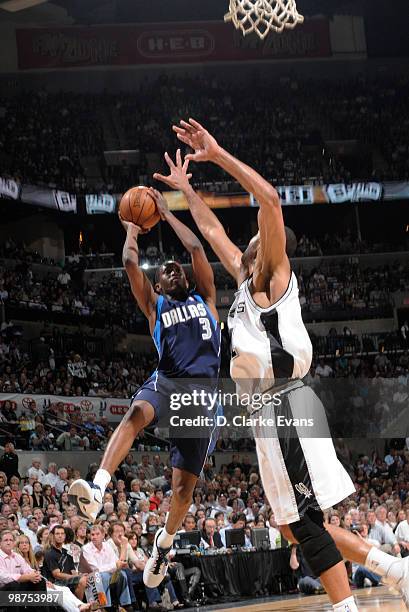 Rodrigue Beaubois of the Dallas Mavericks shoots against Tim Duncan of the San Antonio Spurs in Game Six of the Western Conference Quarterfinals...