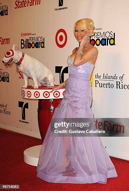 Singer Ivy Queen poses with Bullseye the Target dog at the 2010 Billboard Latin Music Awards at Coliseo de Puerto Rico José Miguel Agrelot on April...