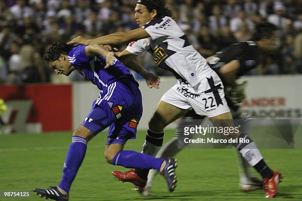 Jose Carlos Fernandez of Alianza Lima fights for the ball with Alejandro Olarra of Universidad de Chile during a match as part of the Libertadores...
