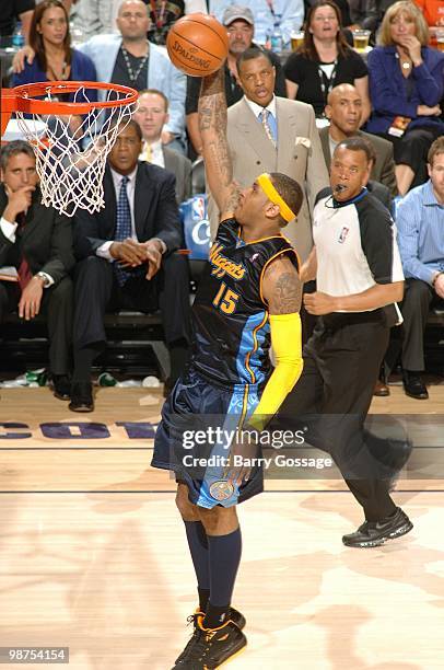 Carmelo Anthony of the Denver Nuggets goes up for a dunk during the game against the Phoenix Suns at U.S. Airways Center on April 13, 2010 in...