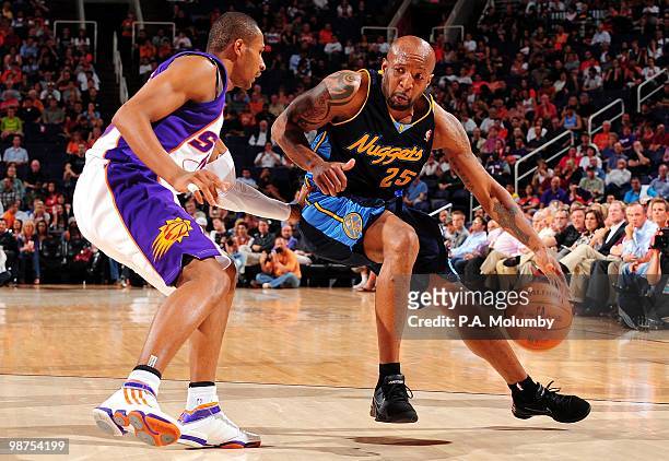 Anthony Carter of the Denver Nuggets posts up against Leandro Barbosa of the Phoenix Suns during the game at U.S. Airways Center on April 13, 2010 in...