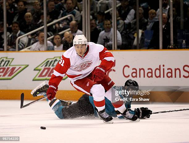 Joe Pavelski of the San Jose Sharks and Valtteri Filppula of the Detroit Red Wings go for the puck in Game One of the Western Conference Semifinals...