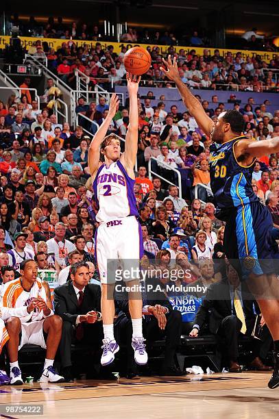 Goran Dragic of the Phoenix Suns shoots over Malik Allen of the Denver Nuggets during the game at U.S. Airways Center on April 13, 2010 in Phoenix,...