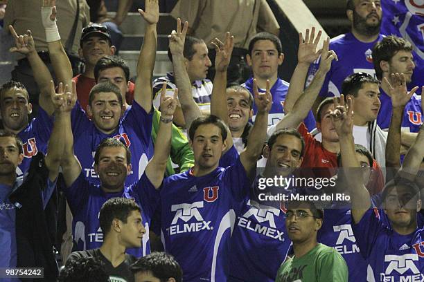 Supporters of Universidad de Chile cheer their team during a match between Alianza Lima and Universidad de Chile as part of the Libertadores Cup at...