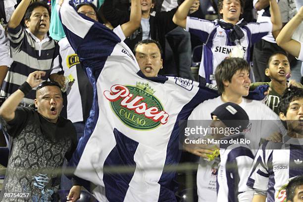 Supporters of Alianza Lima cheer their team during a match between Alianza Lima and Universidad de Chile as part of the Libertadores Cup at Alejandro...