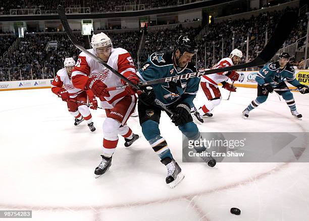 Rob Blake of the San Jose Sharks and Valtteri Filppula of the Detroit Red Wings go for the puck in Game One of the Western Conference Semifinals...