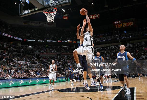 Richard Jefferson of the San Antonio Spurs shoots past Jason Kidd of the Dallas Mavericks in Game Six of the Western Conference Quarterfinals during...