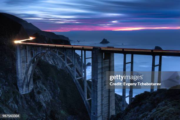 light trails over bixby bridge in california, usa. - ビクスビークリーク ストックフォトと画像