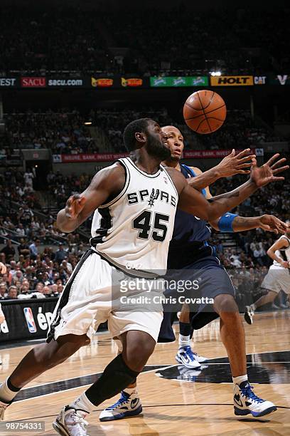 DeJuan Blair of the San Antonio Spurs fights for the ball against Shawne Williams of the Dallas Mavericks in Game Six of the Western Conference...