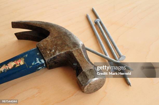 galvanized nails and a claw hammer - claw mark stock pictures, royalty-free photos & images