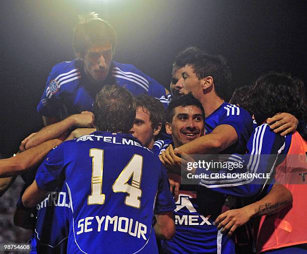 Universidad de Chile's players celebrate Diego Rivarola's last minute goal during their Copa Libertadores football match against Peruvian Alianza...