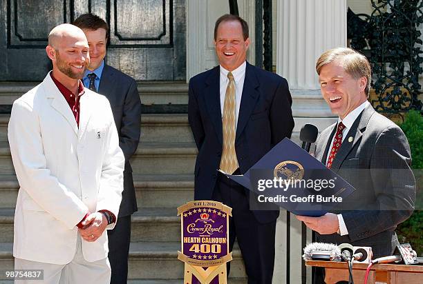 Heath Calhoun , winner of Crown Royal "Your Name Here" military program, is presented with a proclamation by Virginia Governor Bob McDonnell as...