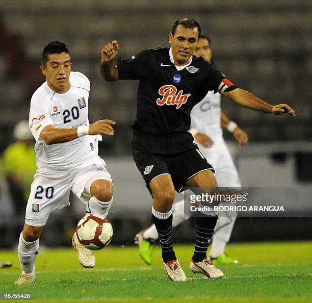 Pedro Sarabia of Paragua's Libertad vies for the ball with Fernando Urribe of Colombia's Once Caldas during their Libertadores Cup football match on...