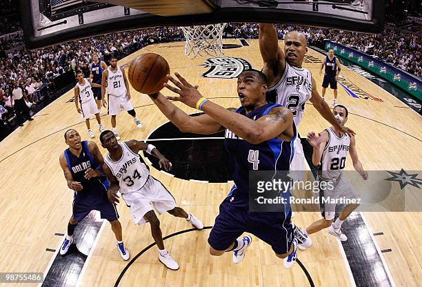 Forward Caron Butler of the Dallas Mavericks takes a shot against Richard Jefferson of the San Antonio Spurs in Game Six of the Western Conference...
