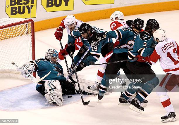 Evgeni Nabokov of the San Jose Sharks makes a save late in the third period of their game against the Detroit Red Wings in the goal in Game One of...