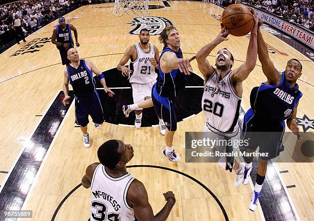 Guard Manu Ginobili of the San Antonio Spurs takes a shot against Caron Butler and Dirk Nowitzki in Game Six of the Western Conference Quarterfinals...