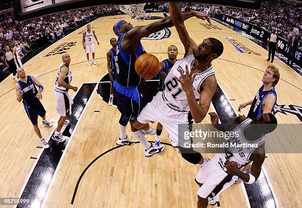 Forward Tim Duncan of the San Antonio Spurs slams the ball against Erick Dampier of the Dallas Mavericks in Game Six of the Western Conference...