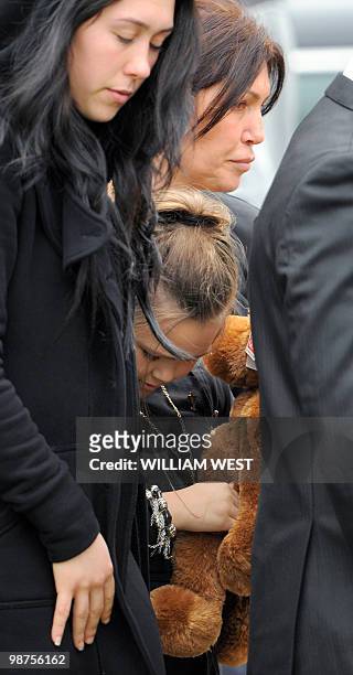 Dhakota Williams , daughter of slain gangland killer Carl Williams, carries a teddy bear as she leaves the church with her mother and Williams...