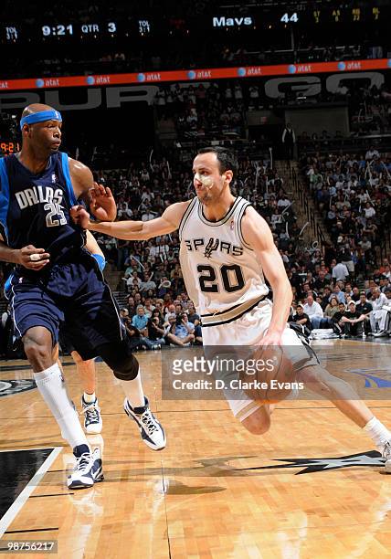 Manu Ginobili of the San Antonio Spurs drives against Erick Dampier of the Dallas Mavericks in Game Six of the Western Conference Quarterfinals...