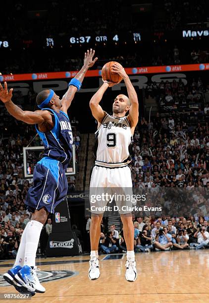 Tony Parker of the San Antonio Spurs shoots against Jason Terry of the Dallas Mavericks in Game Six of the Western Conference Quarterfinals during...