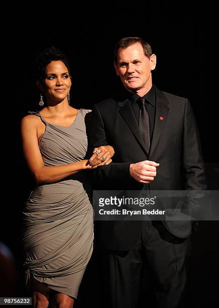 Actress Halle Berry and CEO of Coty Inc. Bernd Beetz onstage at the DKMS' 4th Annual Gala: Linked Against Leukemia at Cipriani 42nd Street on April...