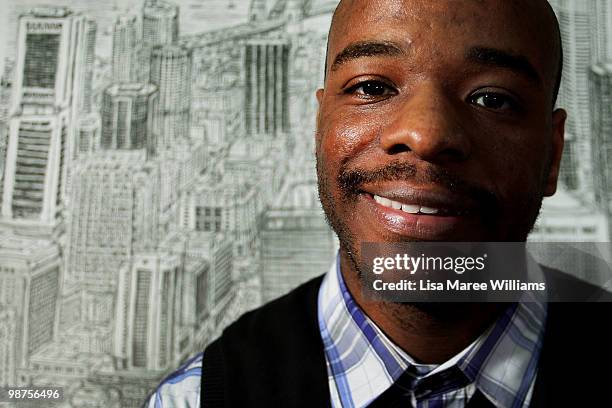 British artist Stephen Wiltshire sits with his detailed sketch of the Sydney cityscape during a press conference at Customs House on April 30, 2010...