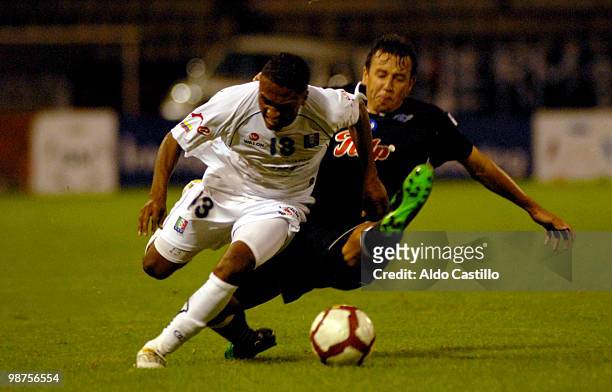 Jose Velez of Once Caldas fights for the ball with Arnaldo Vera of Libertad during a match as part of the Libertadores Cup at Palogrande Stadium on...