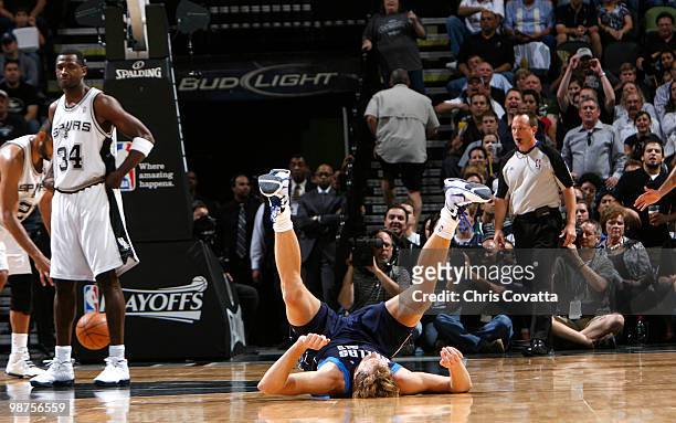 Dirk Nowitzki the Dallas Mavericks hits the hardwood after taking a shot against the San Antonio Spurs in Game Six of the Western Conference...