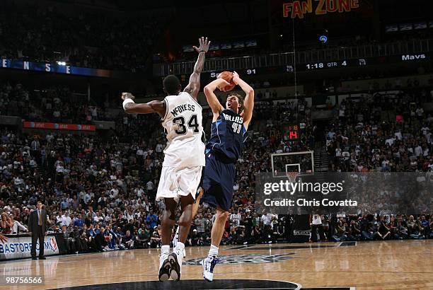 Dirk Nowitzki the Dallas Mavericks shoots over Antonio McDyess of the San Antonio Spurs in Game Six of the Western Conference Quarterfinals during...