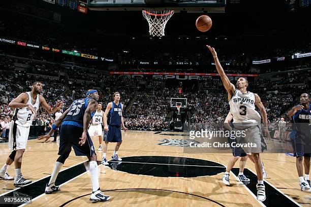 George Hill 33 of the San Antonio Spurs shoots a layup against the Dallas Mavericks in Game Six of the Western Conference Quarterfinals during the...