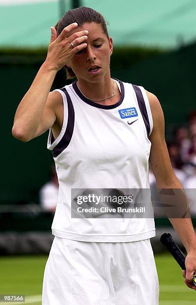 Dejected Karen Cross of Great Britain after lossing to Lisa Raymond of the USA during the women's second round of The All England Lawn Tennis...