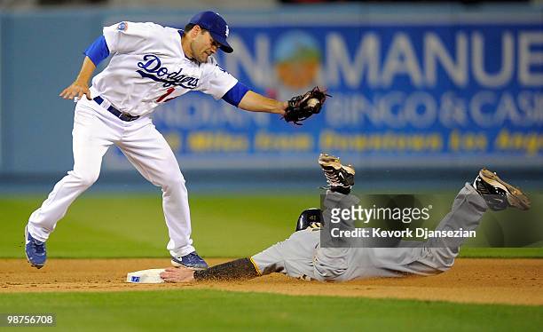 Ryan Doumit of the Pittsburgh Pirates dives under the tag of Jamey Carroll of the Los Angeles Dodgers to steal second base during the fourth first...
