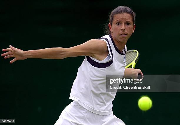Karen Cross of Great Britain in action against Lisa Raymond of the USA during the women's second round of The All England Lawn Tennis Championship at...