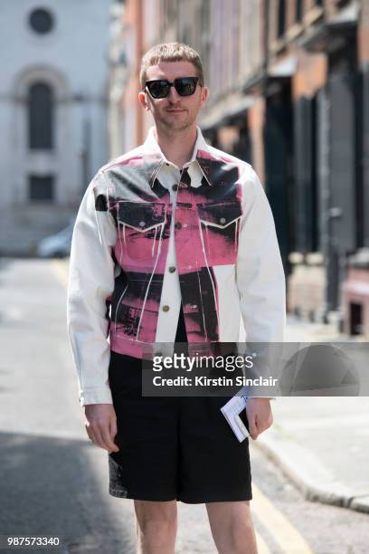 Head of content fashion and features at Drapers Graeme Moran wears a Calvin Klein jacket, Acne shorts, Vans trainers and Han Kjobenhavn sunglasses...