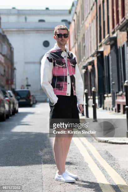 Head of content fashion and features at Drapers Graeme Moran wears a Calvin Klein jacket, Acne shorts, Vans trainers and Han Kjobenhavn sunglasses...