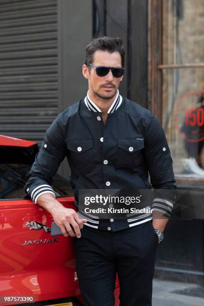 Model David Gandy wears a Dolce and Gabbana jacket during London Fashion Week Men's on June 10, 2018 in London, England.