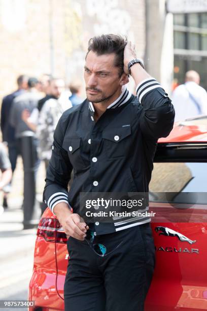 Model David Gandy wears a Dolce and Gabbana jacket during London Fashion Week Men's on June 10, 2018 in London, England.