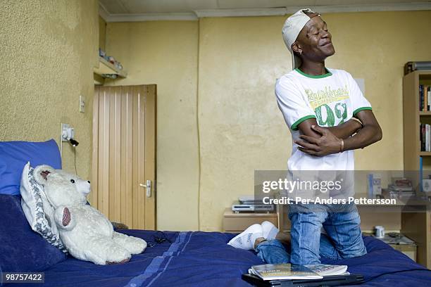 Thami Nkosi, a 29-year old activist, sits on his bed in his room on January 15 in Soweto, South Africa. Thami is a gender justice activist and often...