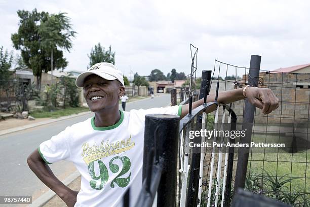 Thami Nkosi, a 29-year old activist, stands outside his house on January 15 in Soweto, South Africa. Thami is a gender justice activist and often...