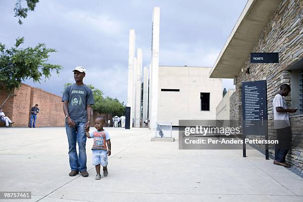 Thami Nkosi, a 29-year old activist, visits the Apartheid museum with his son on January 17 in Johannesburg, South Africa. Thami is a gender justice...