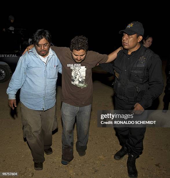 Mexican photographer David Cilia is helped by police at a hospital in Santiago Juxtlahuaca, Mexico on April 30, 2010. Cilia escaped an ambush by...