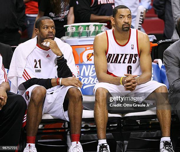 Marcus Camby and Juwan Howard of the Portland Trail Blazers sit on the bench as time runs out against the Phoenix Suns during Game Six of the Western...
