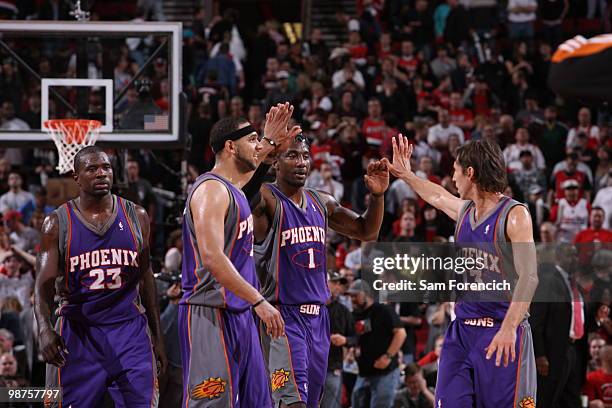 Jason Richardson, Jared Dudley, Amar'e Stroudemire and Steve Nash of the Phoenix Suns congratulate each other on their win against the Portland Trail...