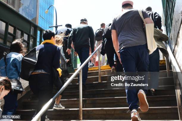 crowd exiting subway station in new york city. - 通勤 ストックフォトと画像