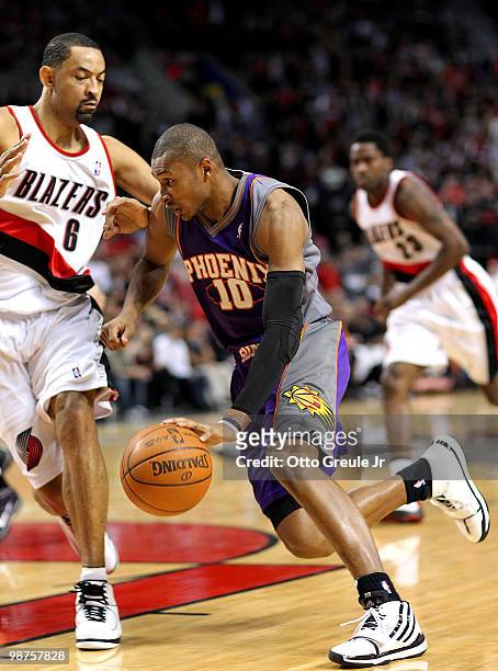 Leandro Barbosa of the Phoenix Suns drives against Juwan Howard of the Portland Trail Blazers during Game Six of the Western Conference Quarterfinals...