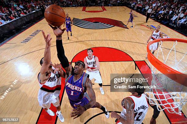 Amar'e Stoudemire of the Phoenix Suns grabs for a rebound against Brandon Roy of the Portland Trail Blazers in Game Six of the Western Conference...