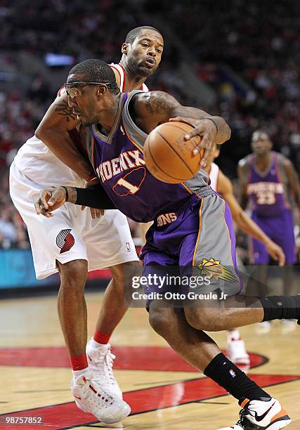 Amare Stoudemire of the Phoenix Suns drives against Marcus Camby of the Portland Trail Blazers during Game Six of the Western Conference...